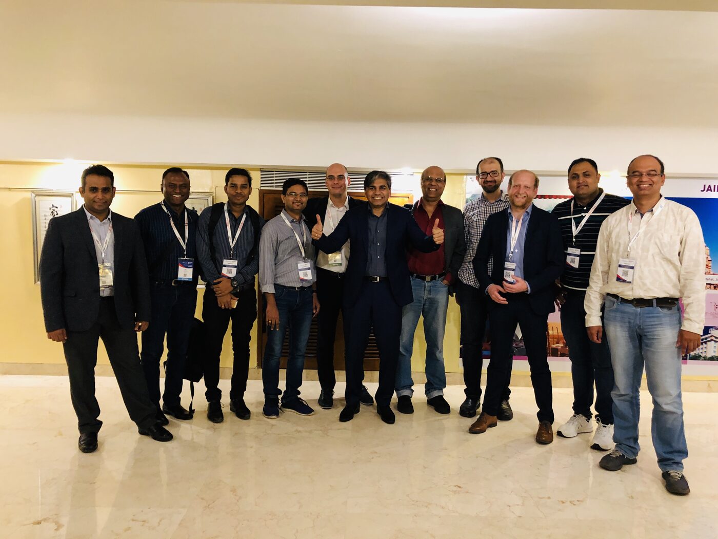 The eleven-person workshop cohort photographed together in the venue lobby at the end of the session.