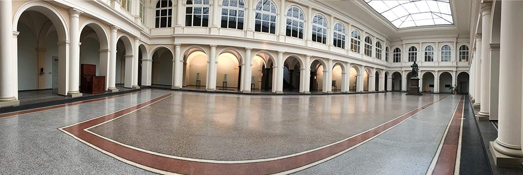 The historic atrium of the host university building