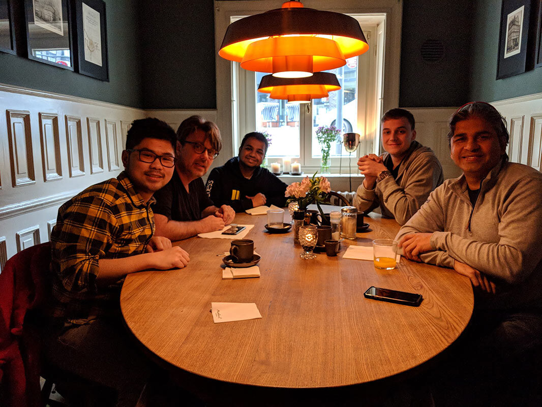 The meetup group around a table before the talk