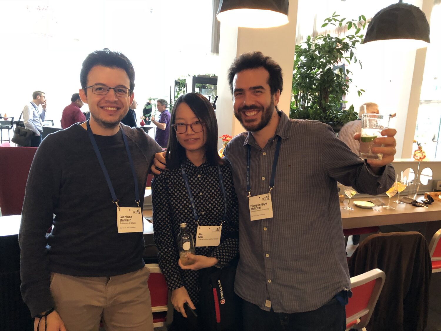 Three delegates with ICSE 2018 badges from Chalmers University of Technology and Politecnico di Milano at the conference reception.
