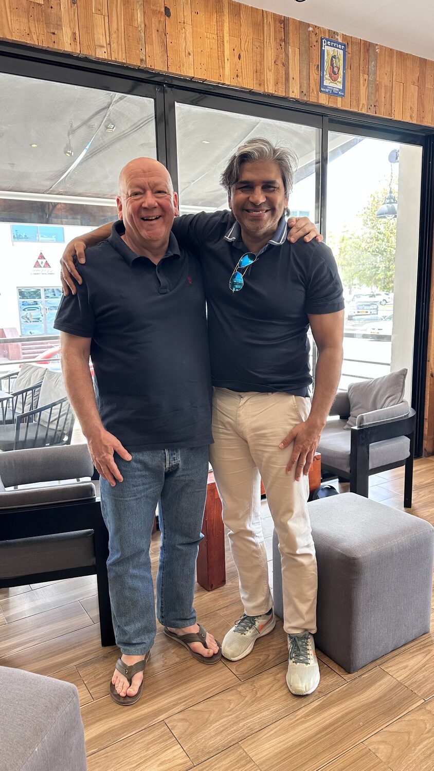 Two colleagues in the office in Muscat at the end of the working session.