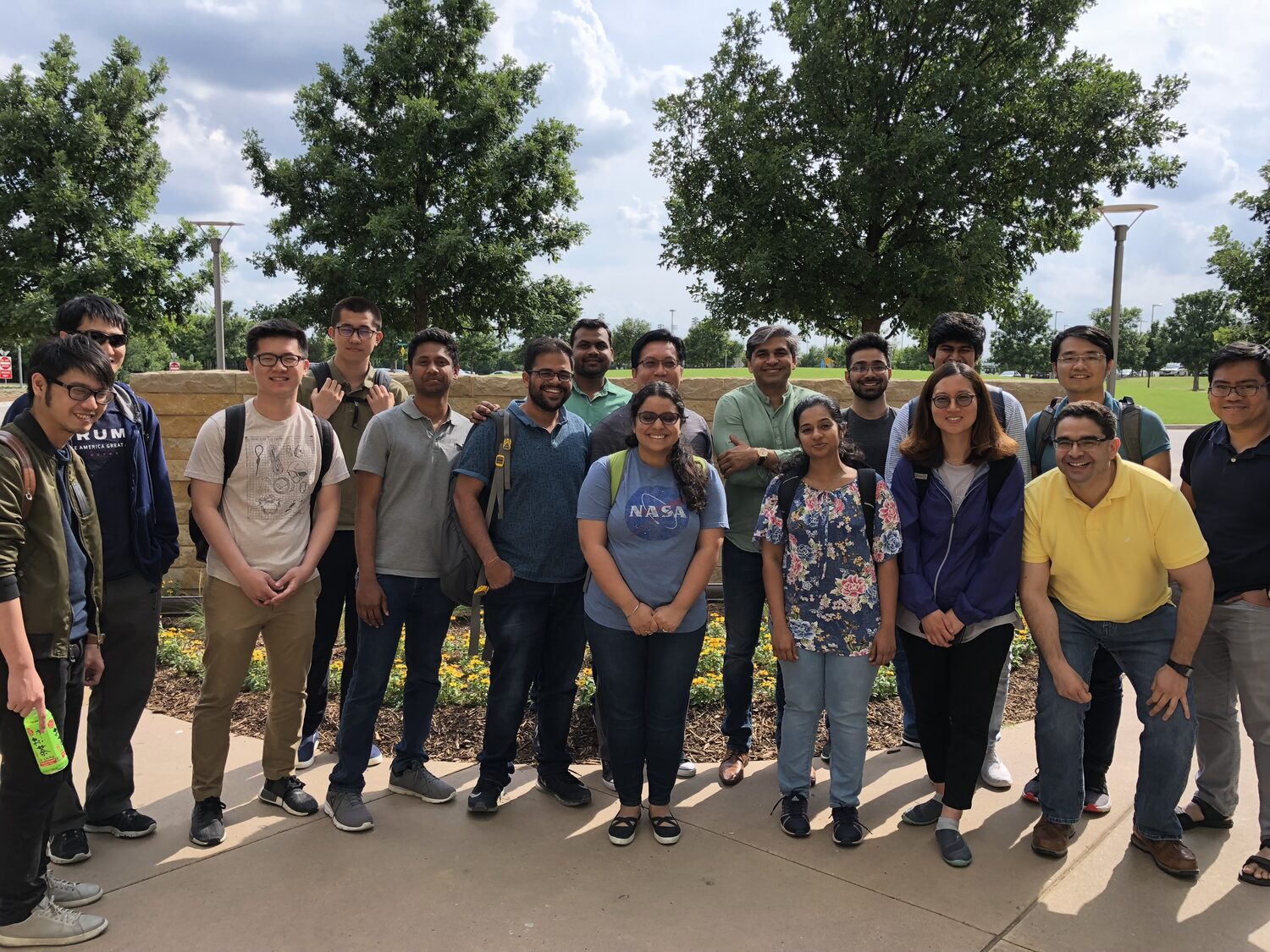 Second group photograph of the cohort outdoors on the UT Dallas campus
