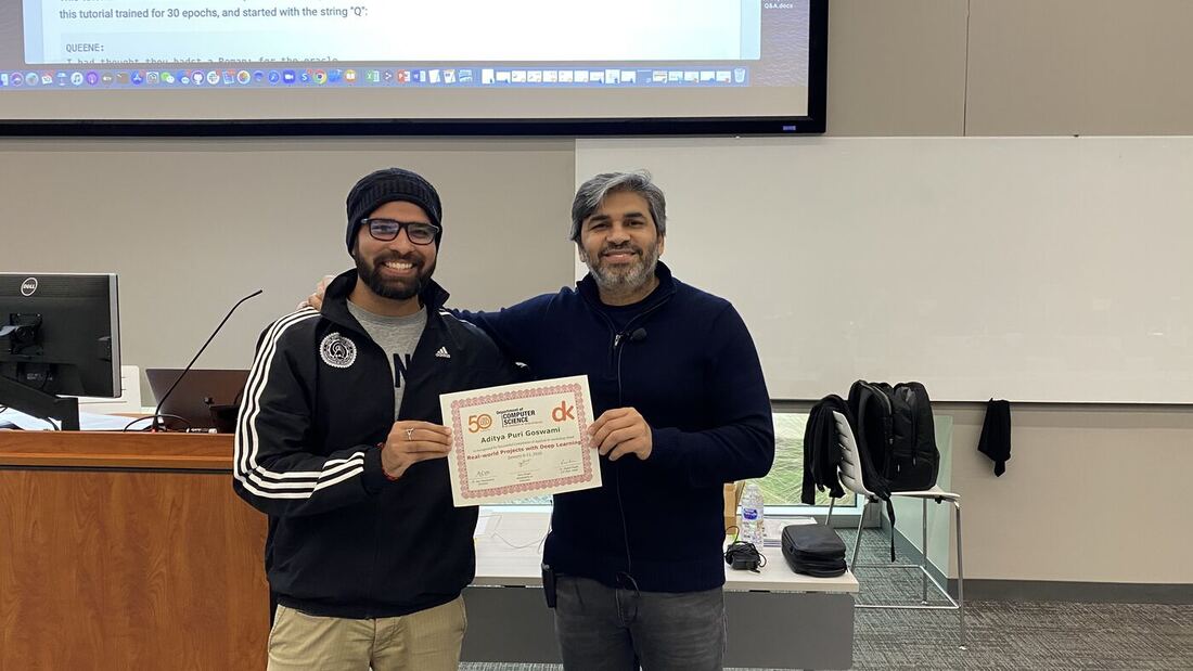 A participant receives the certificate of completion at the front of the hall on the closing day.